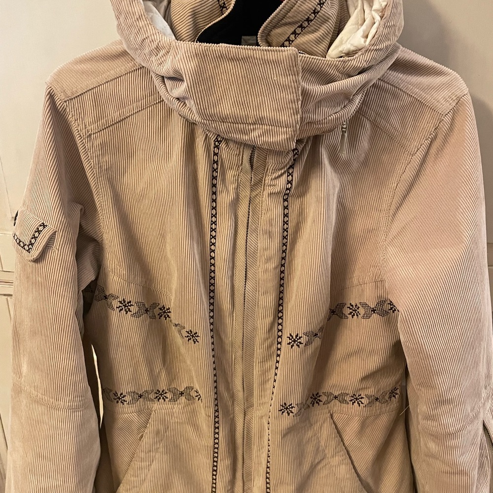 NILS brand camel colored ski jacket.